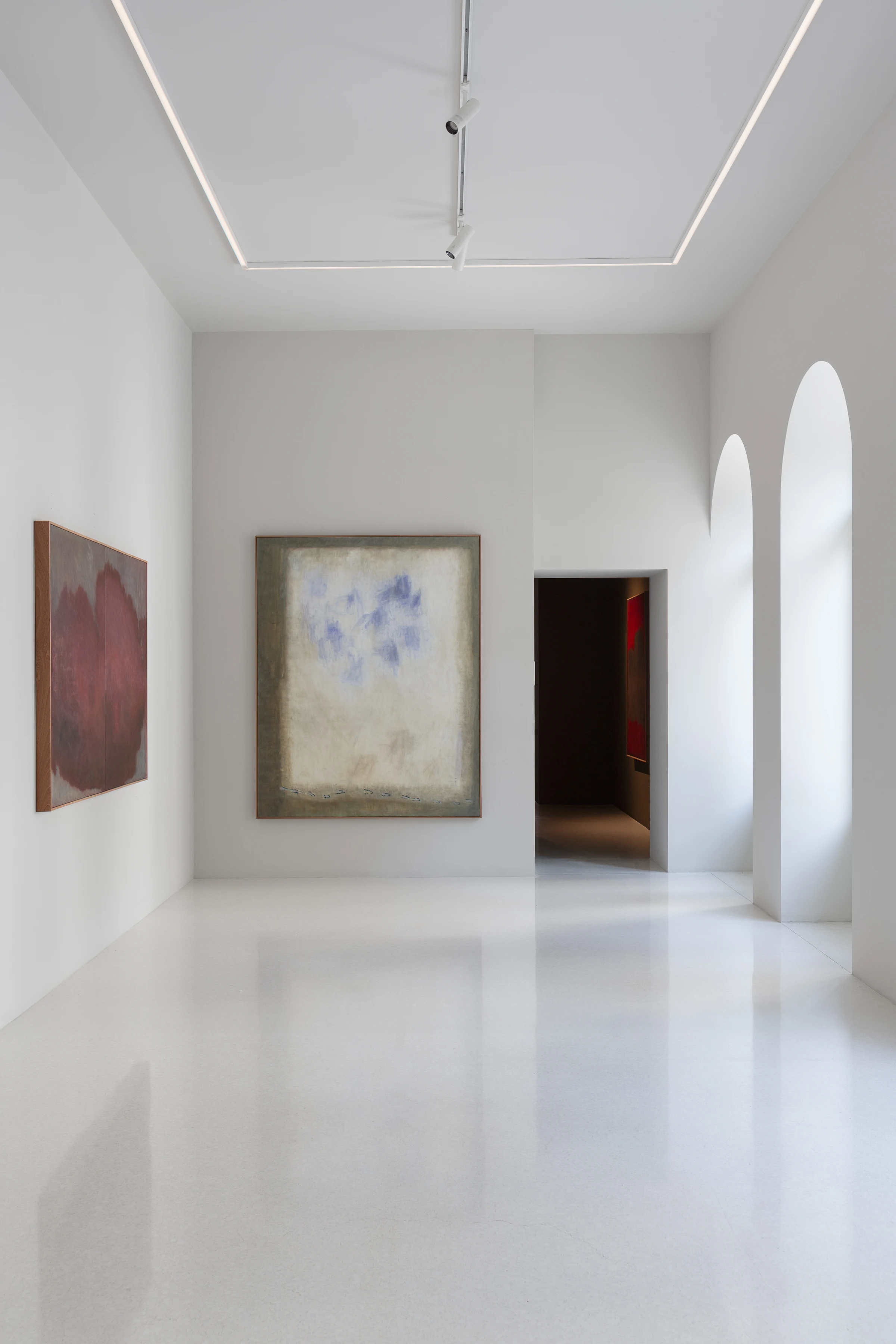 Abstract paintings in the tall, light-filled spaces of Cadogan Gallery in Milan.