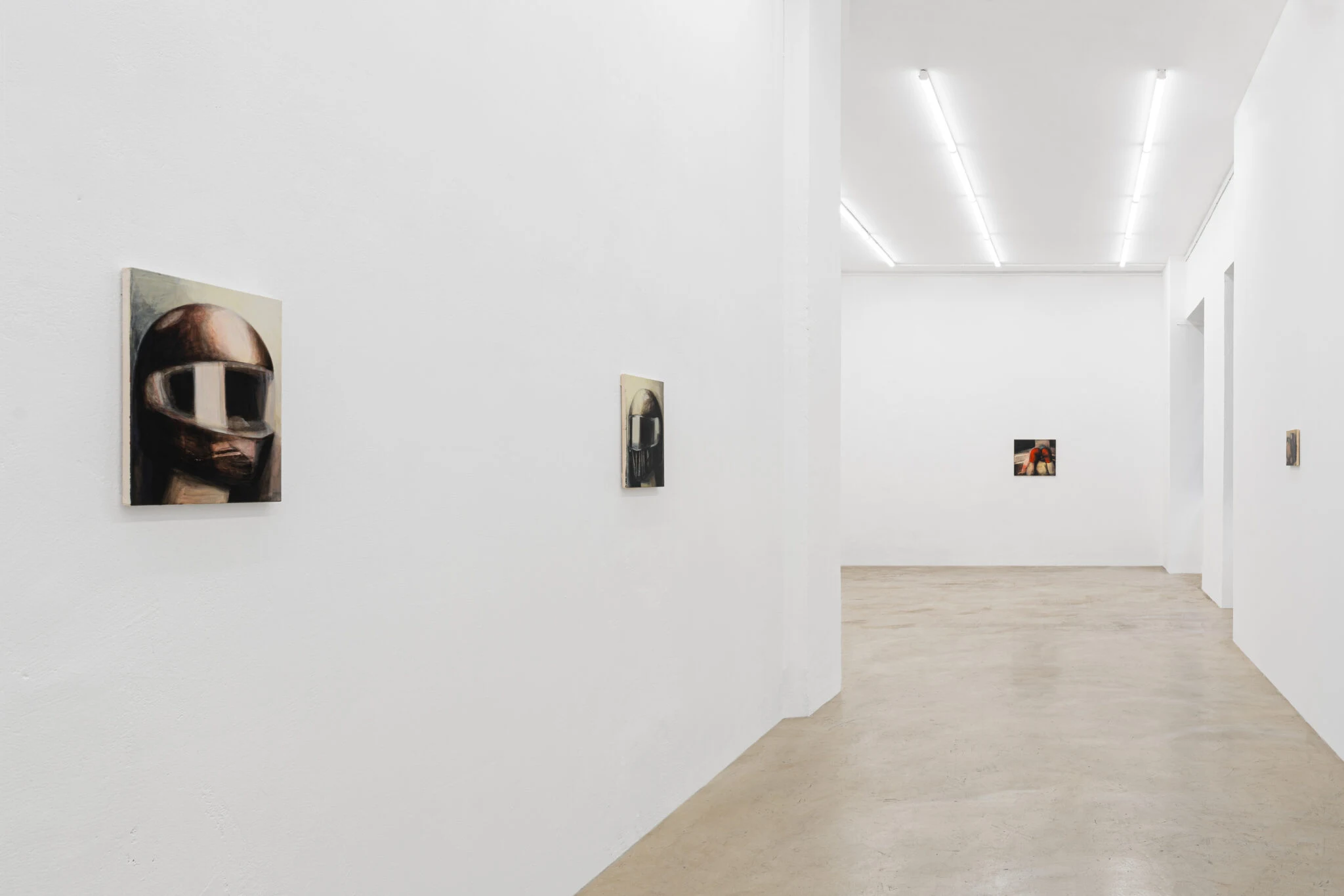 Small paintings by Emma Masut installed across the white walls of Clima.